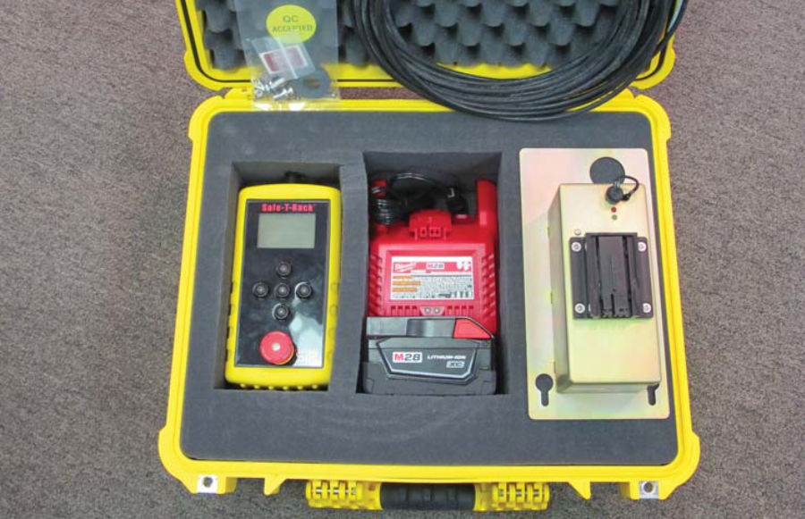 A remote racking device showed in its stored location in a weather-proof hard case.